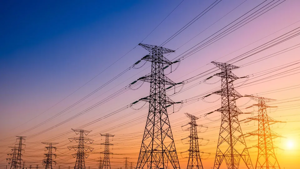 Electric grid infrastructure viewed at sunset
